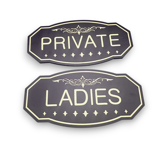 Two decorative signs with 'PRIVATE' and 'LADIES' text on a white background